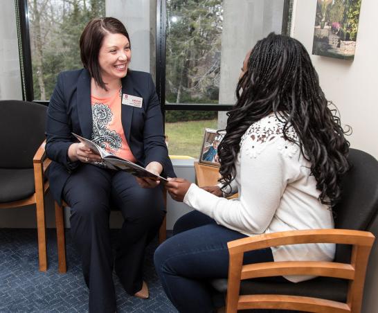 Admissions counselor Ashley Hanson meets with a student.